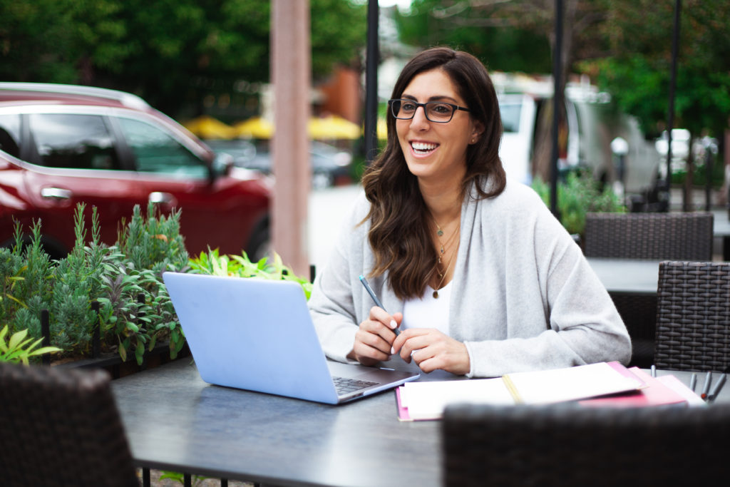 woman working from table outside